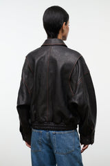 Distressed brown leather jacket back view with ribbed waistband and elastic cuffs