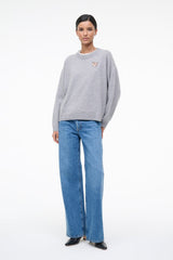 Heather grey cashmere crewneck sweater with long sleeves and small chest logo