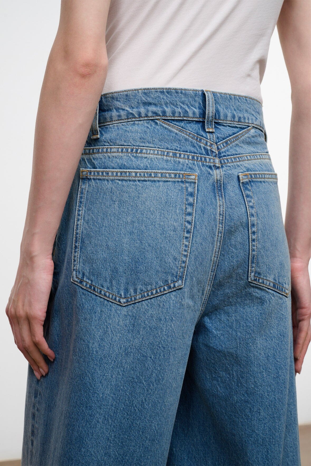 Light blue denim culotte jeans with button fly and patch pockets