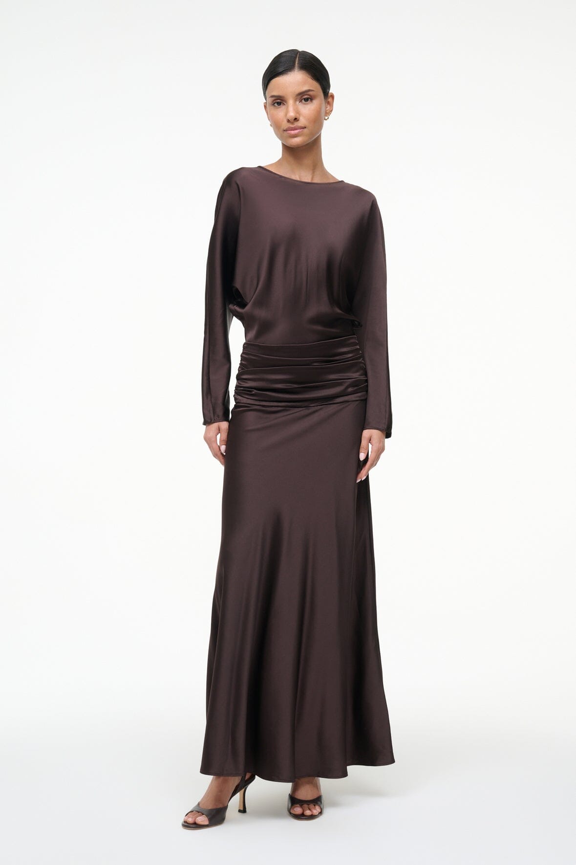 Silk dress in dark brown with long sleeves and gathered ruched waist, ankle-length.