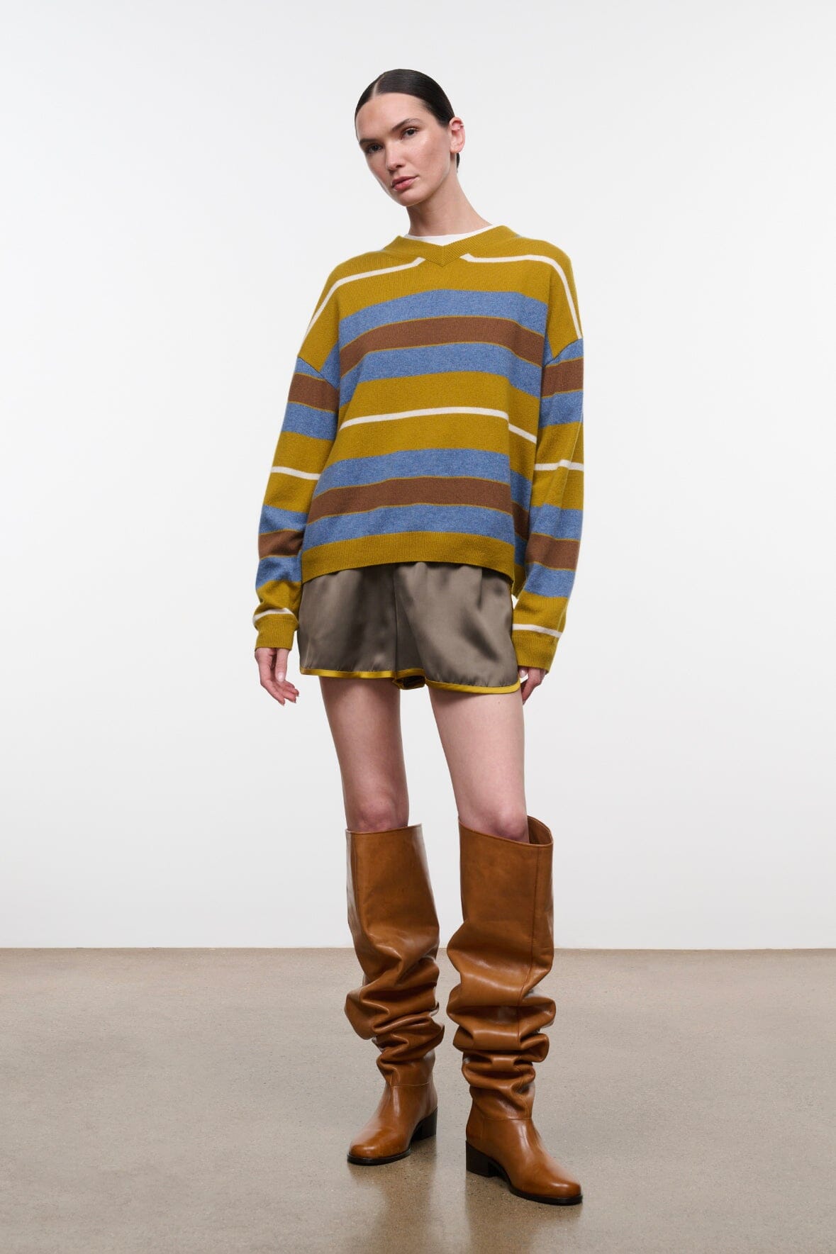Dark gray drawstring shorts with yellow edge trim and elastic waist