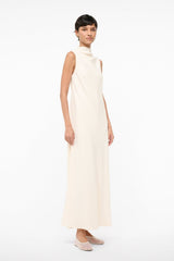 Ivory sleeveless turtleneck midi dress with fitted bodice