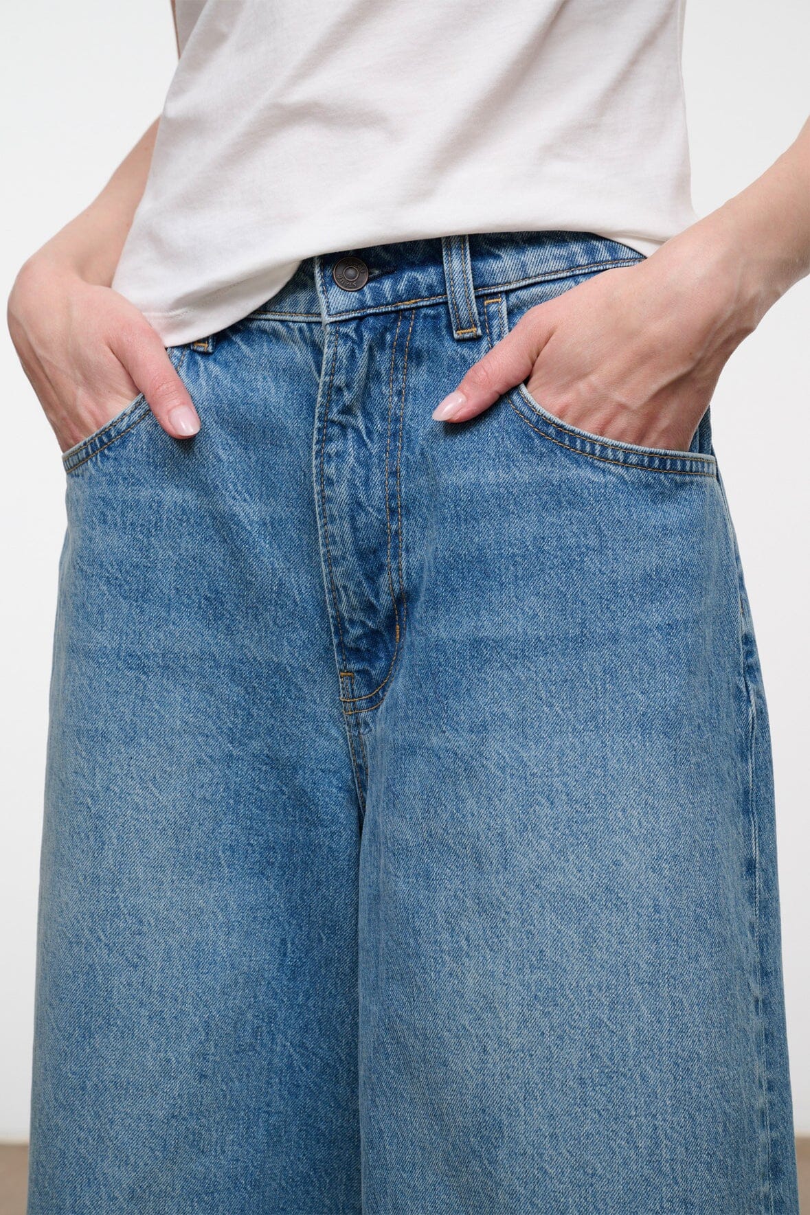 Light blue denim culotte jeans with belt loops and side patch pockets