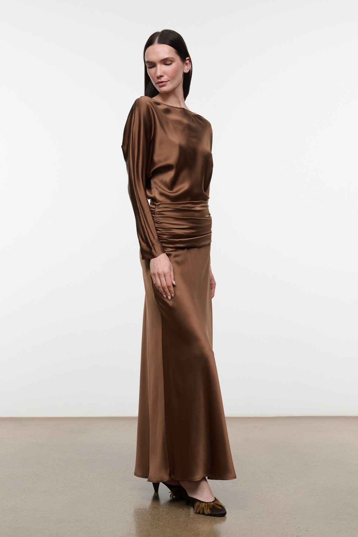 Brown satin-sheen silk dress with long sleeves, side ruching and ankle-length skirt