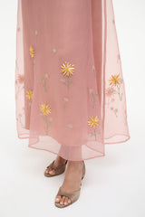 Heeled sandals with blush sheer hem, featuring small yellow flower embroidery