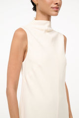 Ivory sleeveless turtleneck dress neckline close-up