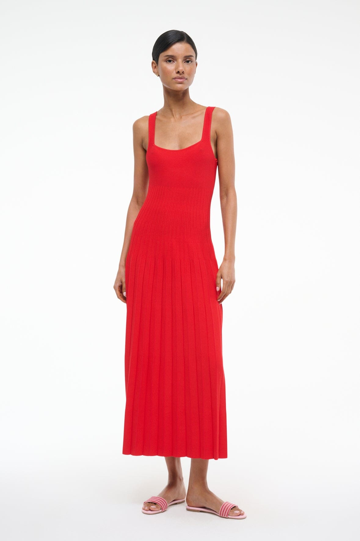 Red sleeveless pleated midi dress with square neckline and fitted waist