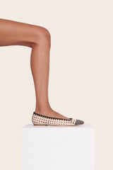 Cream and black crochet ballerina flats, side view with braided trim