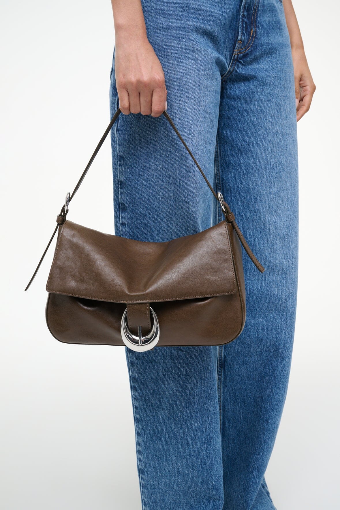 Truffle brown medium shoulder bag with flap, silver-tone horseshoe clasp, side tassel ties
