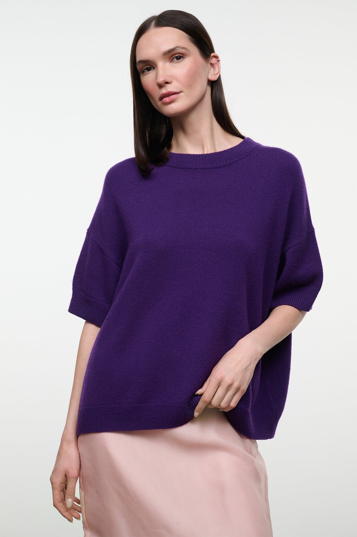 Purple cashmere sweater with crew neck and short sleeves, relaxed drape, front view.