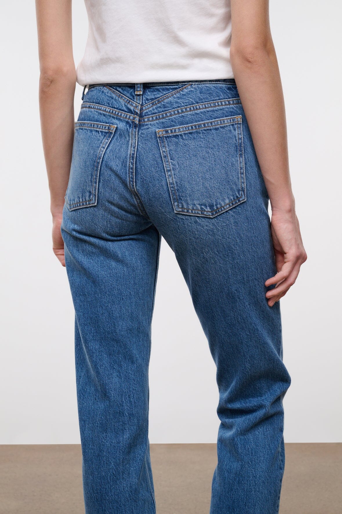 Straight jeans in vintage wash, medium blue denim with front pockets and stitched seams