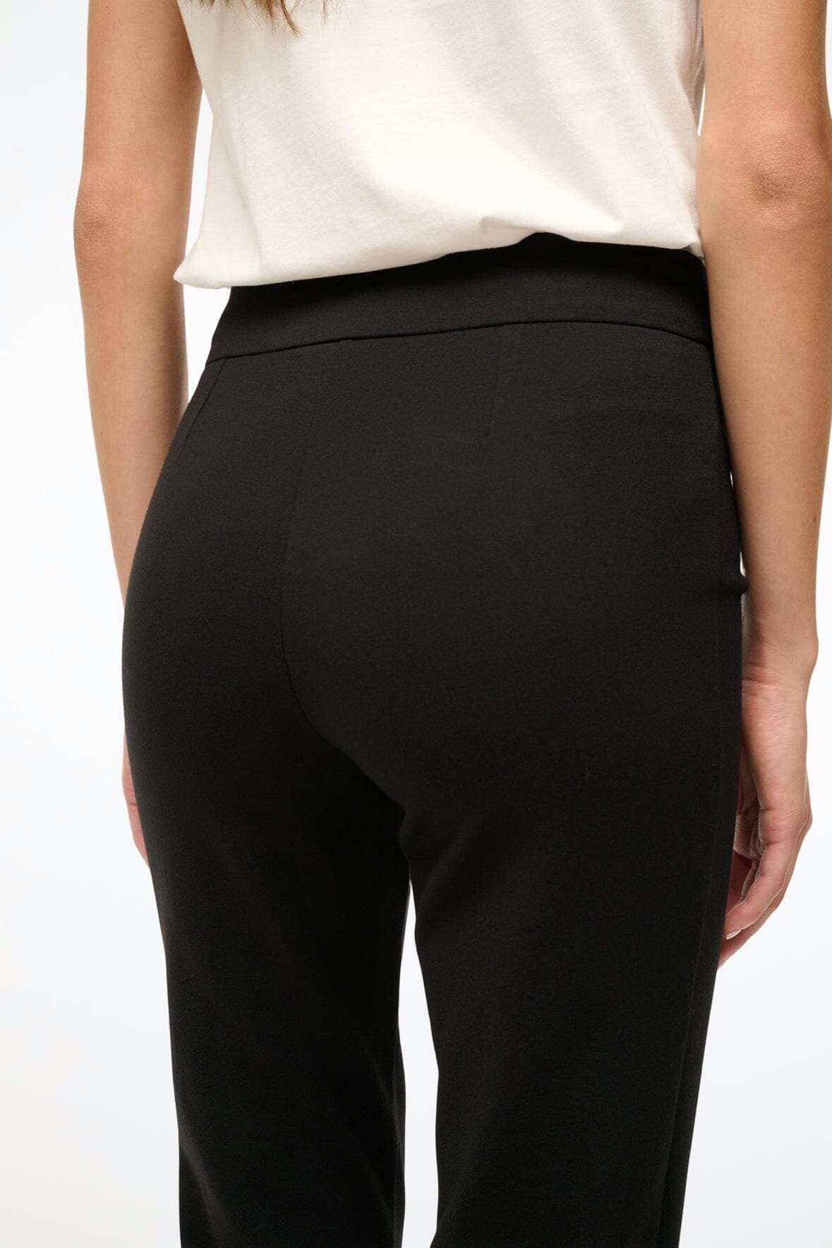 Black cropped pants close-up of side seam and hip shaping