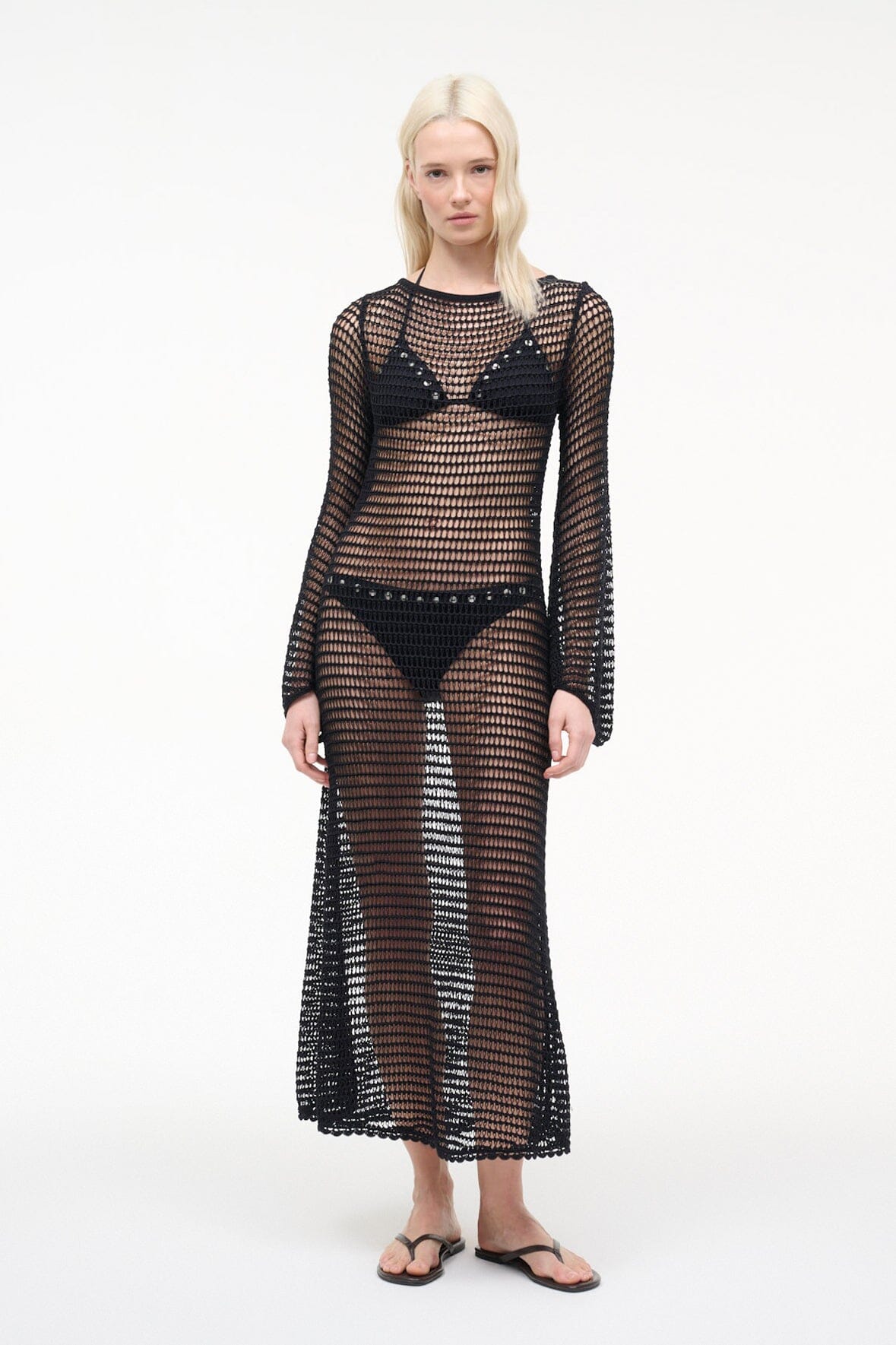 Black mesh maxi dress with long sleeves, geometric pattern, and V-front panel