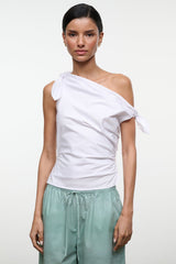 White one-shoulder draped sleeveless top with shoulder knot, front view