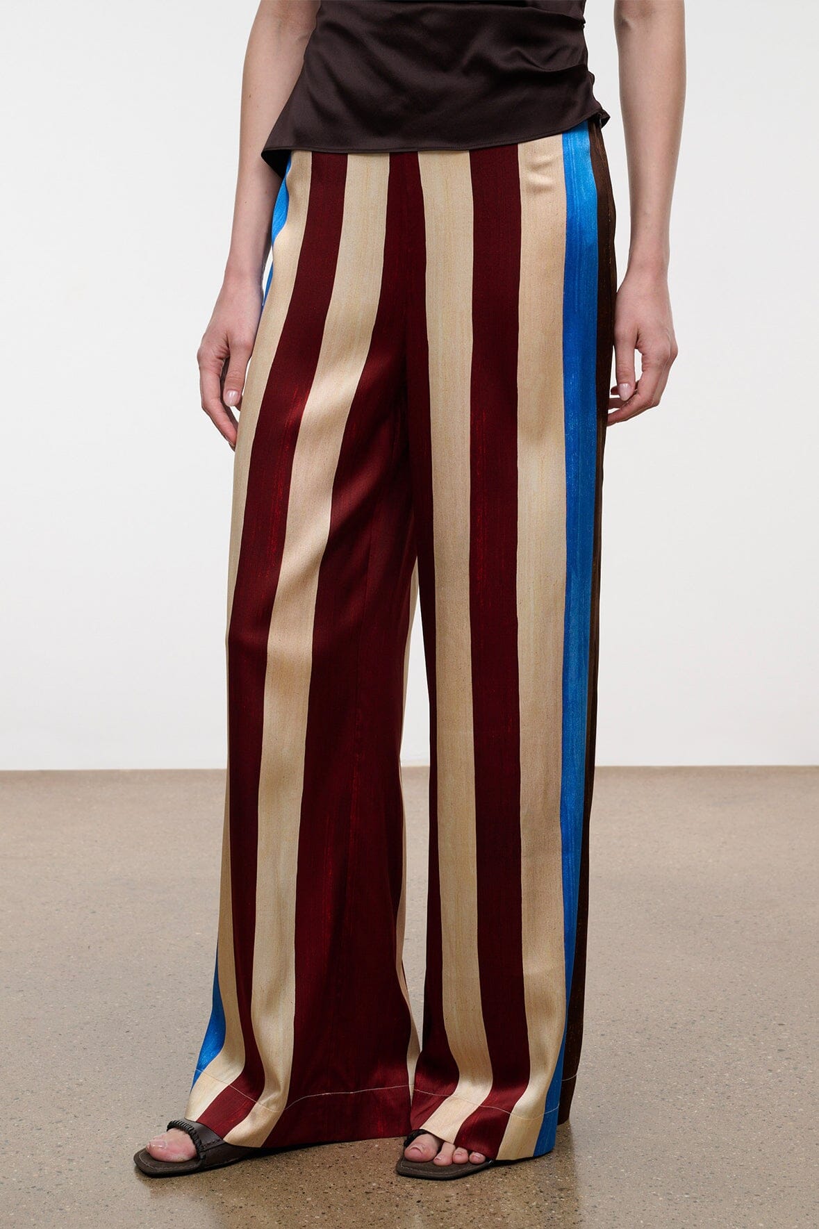 Silk wide-leg pants with vertical stripes and bright blue side panel