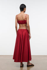 Back view of red midi skirt with gathered waistband and soft pleats