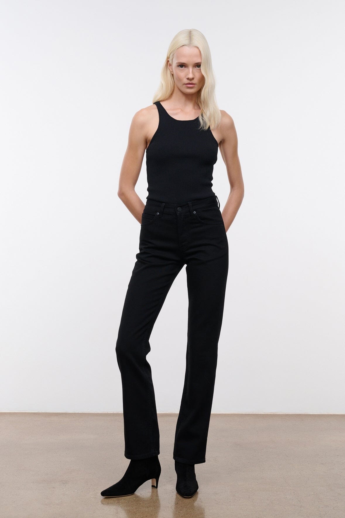 Black straight-leg denim jeans, front view with relaxed straight fit