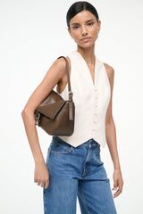 Truffle brown medium shoulder bag worn crossbody with flap and silver-tone horseshoe clasp