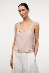 Light pink studded tank top with silver studs around neckline and lower edge