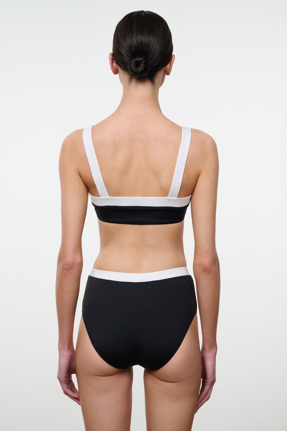 Black and white bikini top with racerback straps and white-trim elastic band