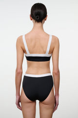 Black and white bikini top with racerback straps and white-trim elastic band