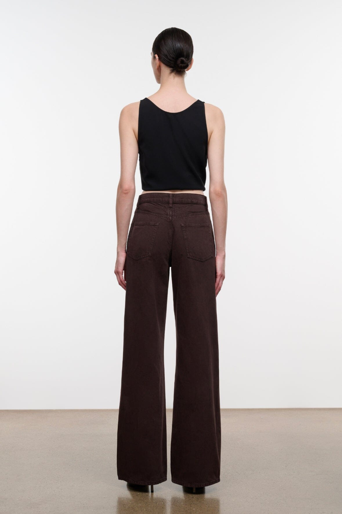 Dark brown wide-leg DEAN jeans back view with waistband and back patch pockets