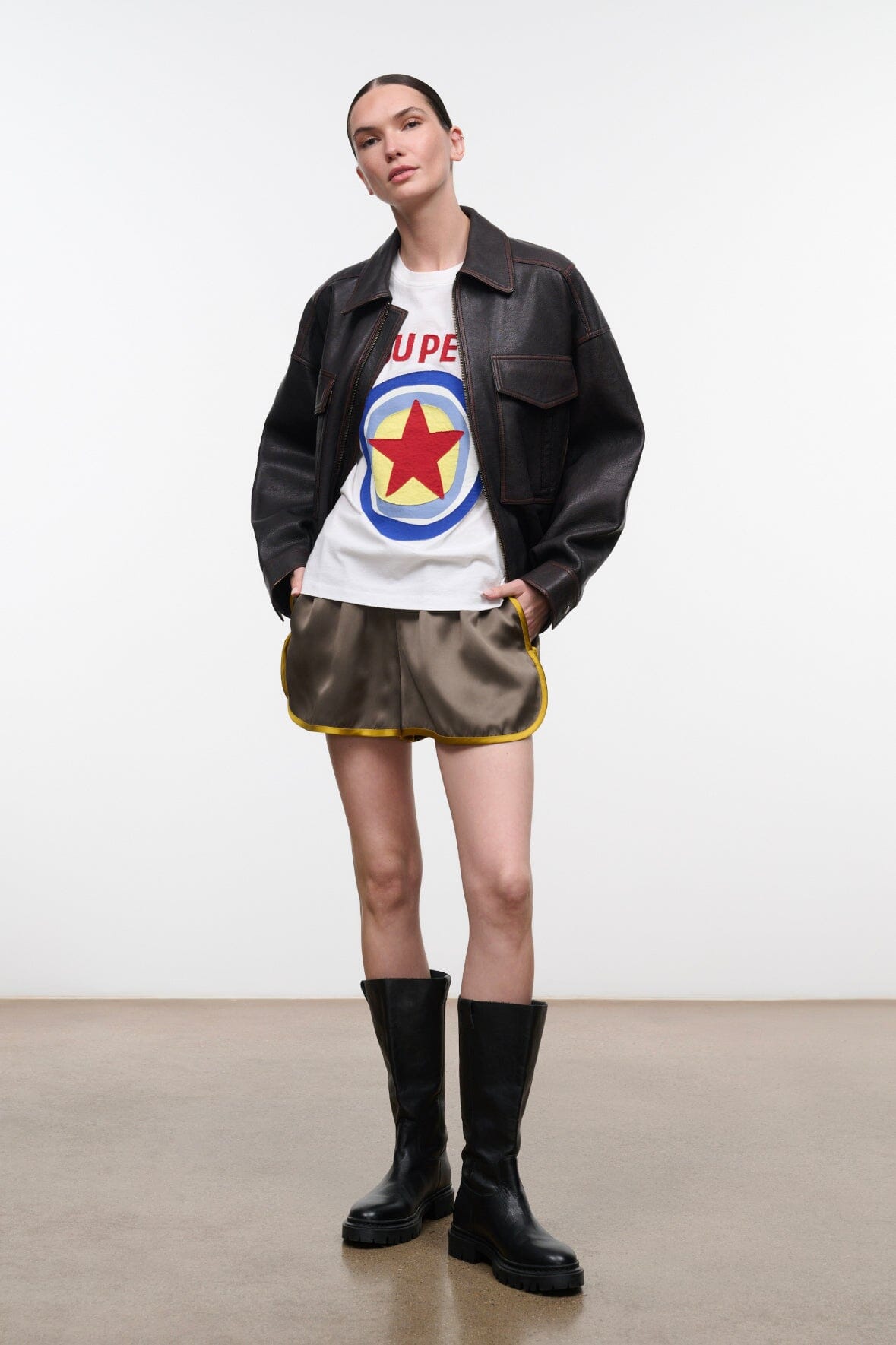 White relaxed tee under black jacket, SUPER STAR star logo on front