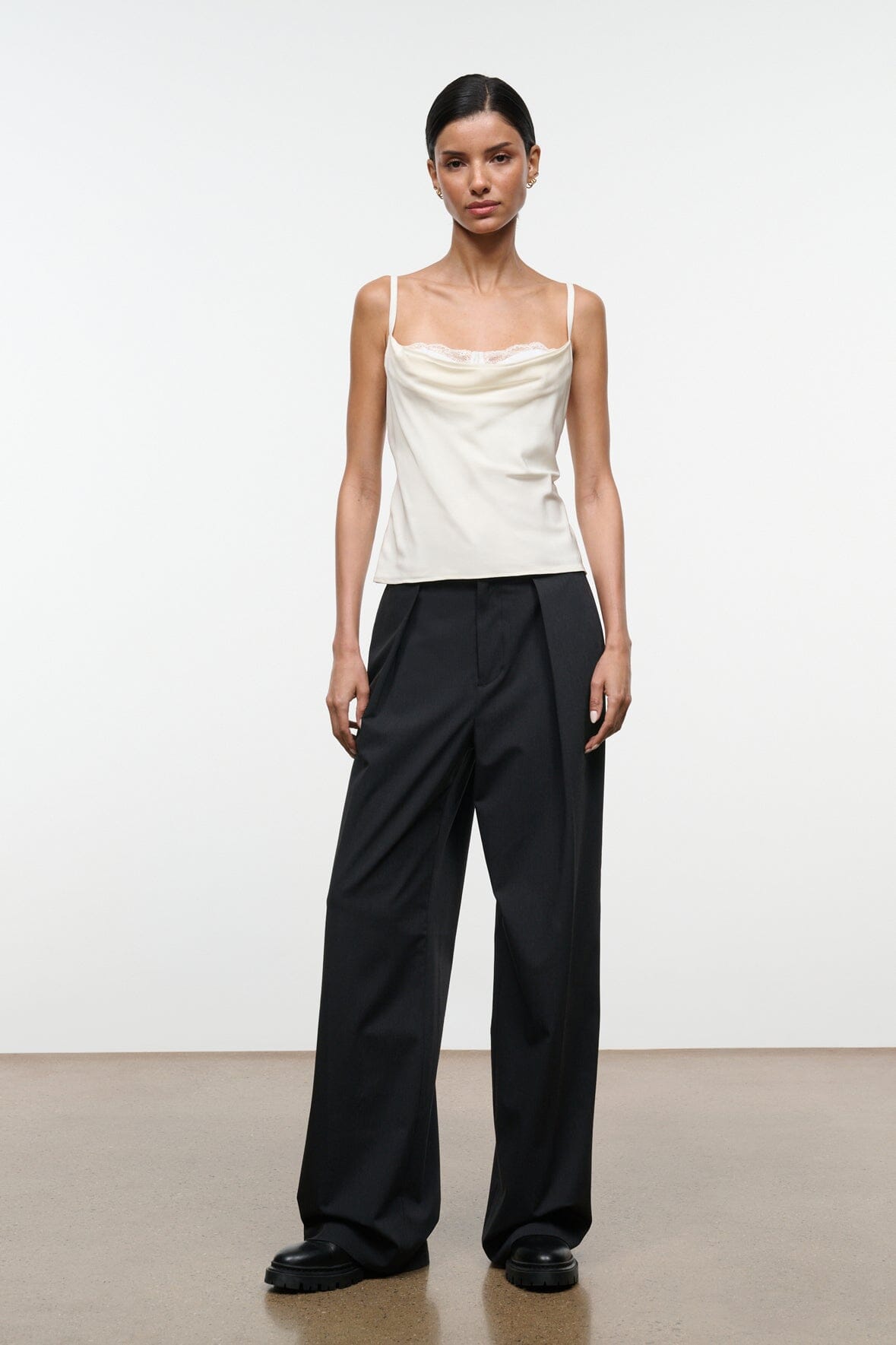 Ivory silk camisole top with lace-trim neckline and spaghetti straps