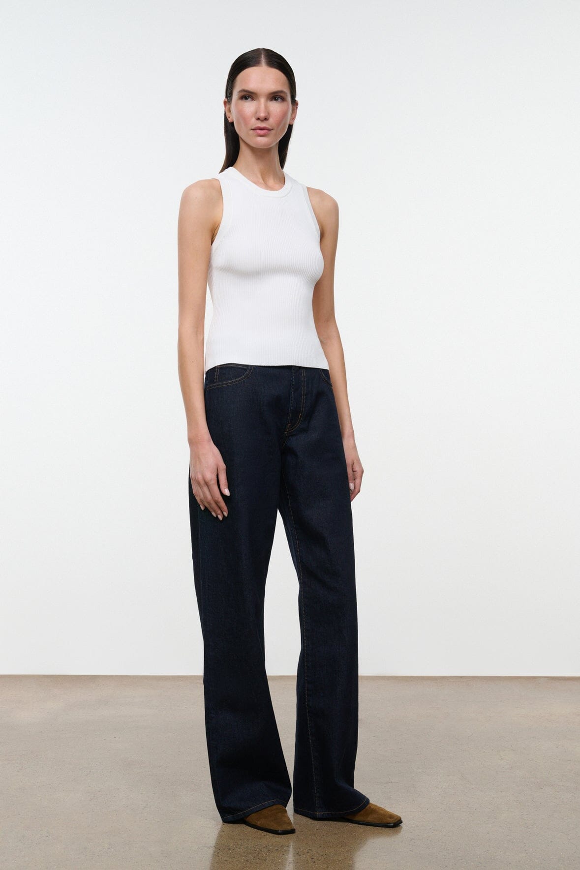 Indigo wide-leg jeans with high rise, front pockets, and dark indigo denim wash.