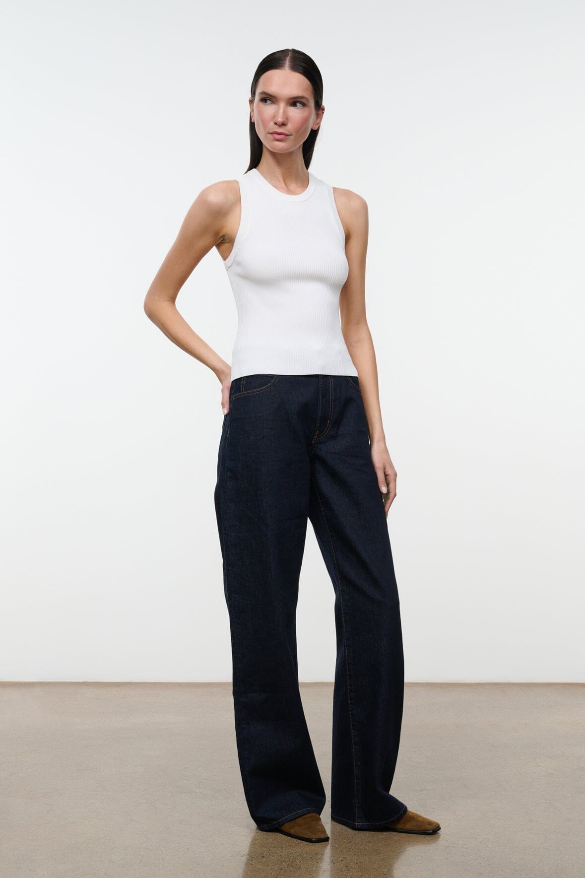 Indigo wide-leg jeans with button waistband and relaxed straight-leg silhouette.