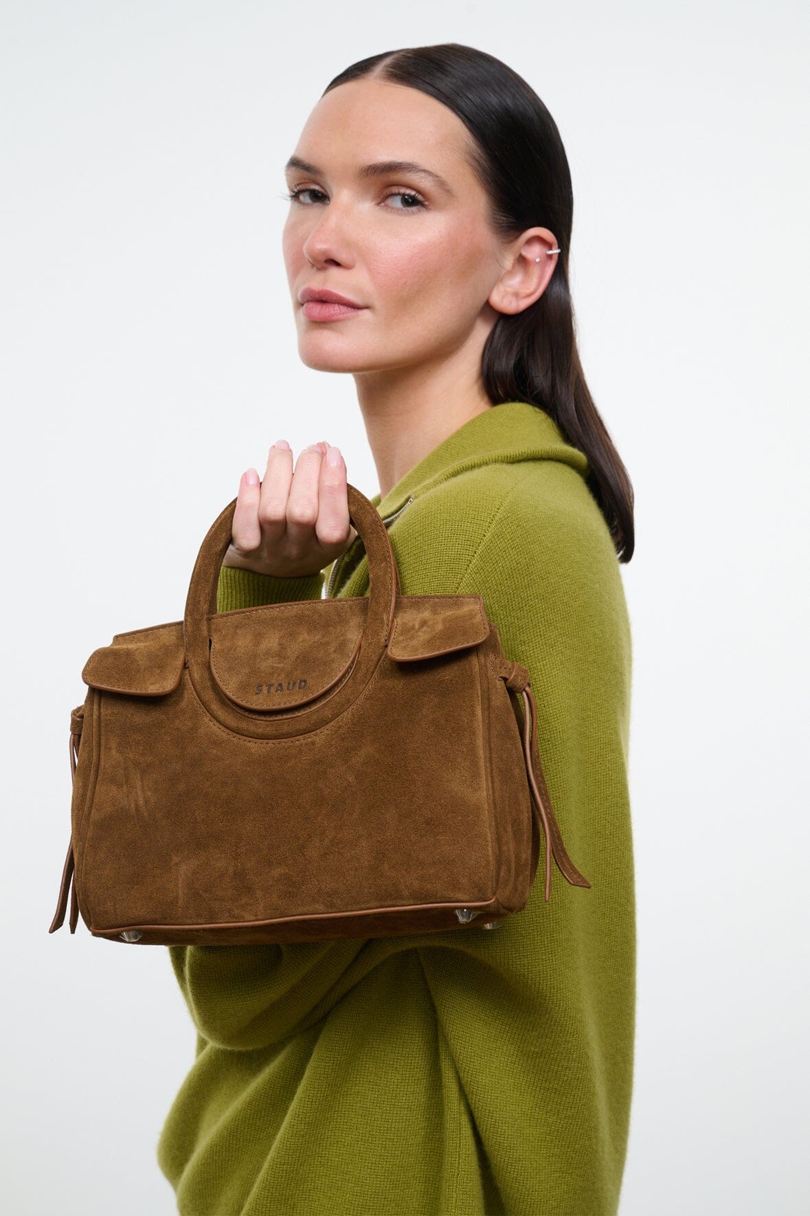 Cigar-brown suede mini carryall handbag with top handle and front snap tab.