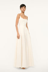 Ivory maxi dress with fitted waist and flowing pleated skirt