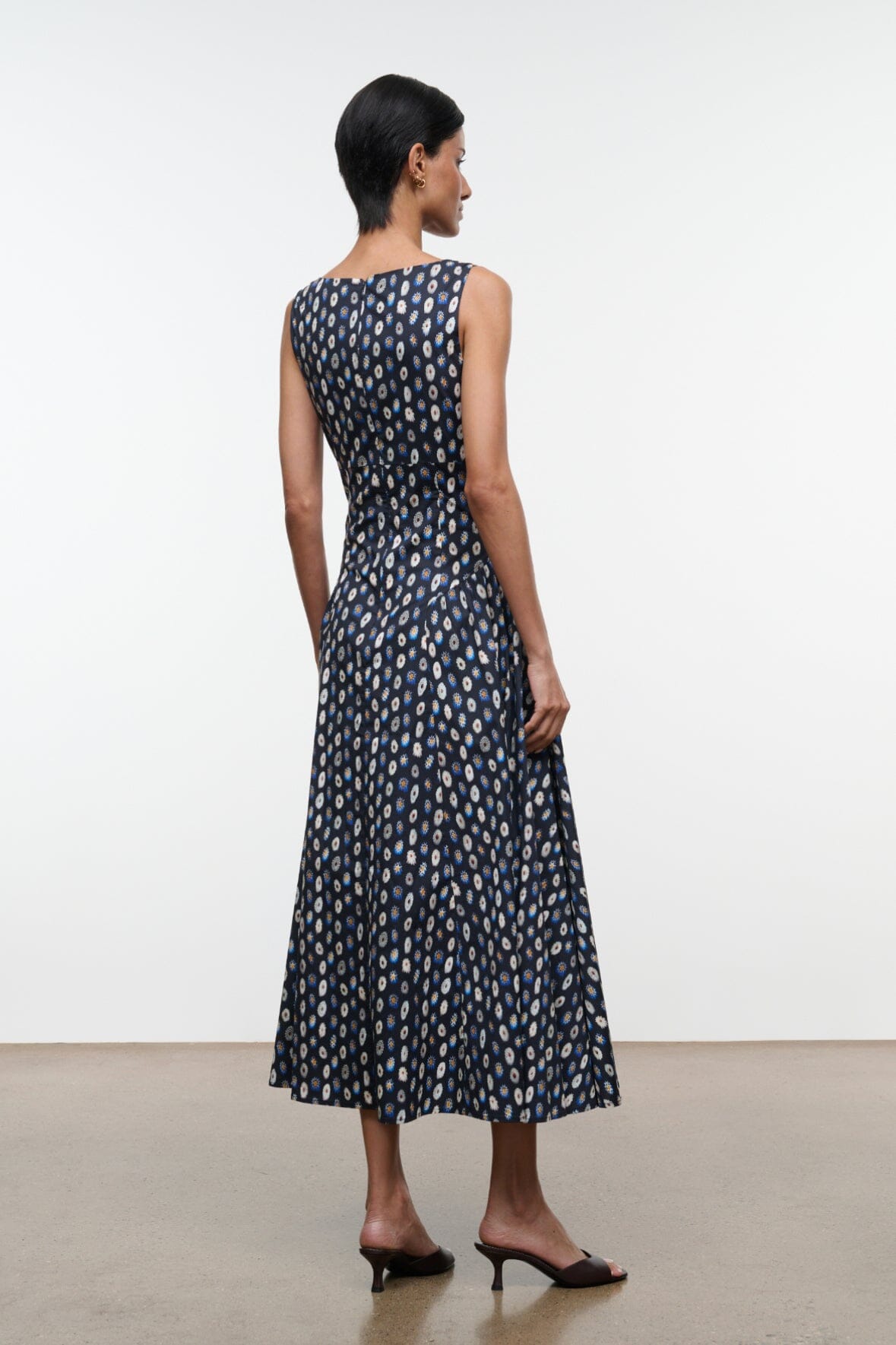 Navy sleeveless midi dress with abstract yellow dot print, scoop back and gathered waist