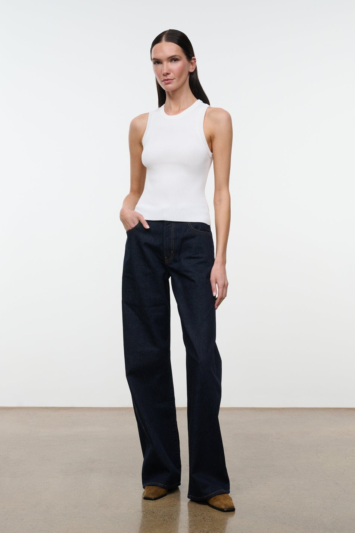 Indigo wide-leg jeans with roomy legs, front pockets, and visible belt loops.