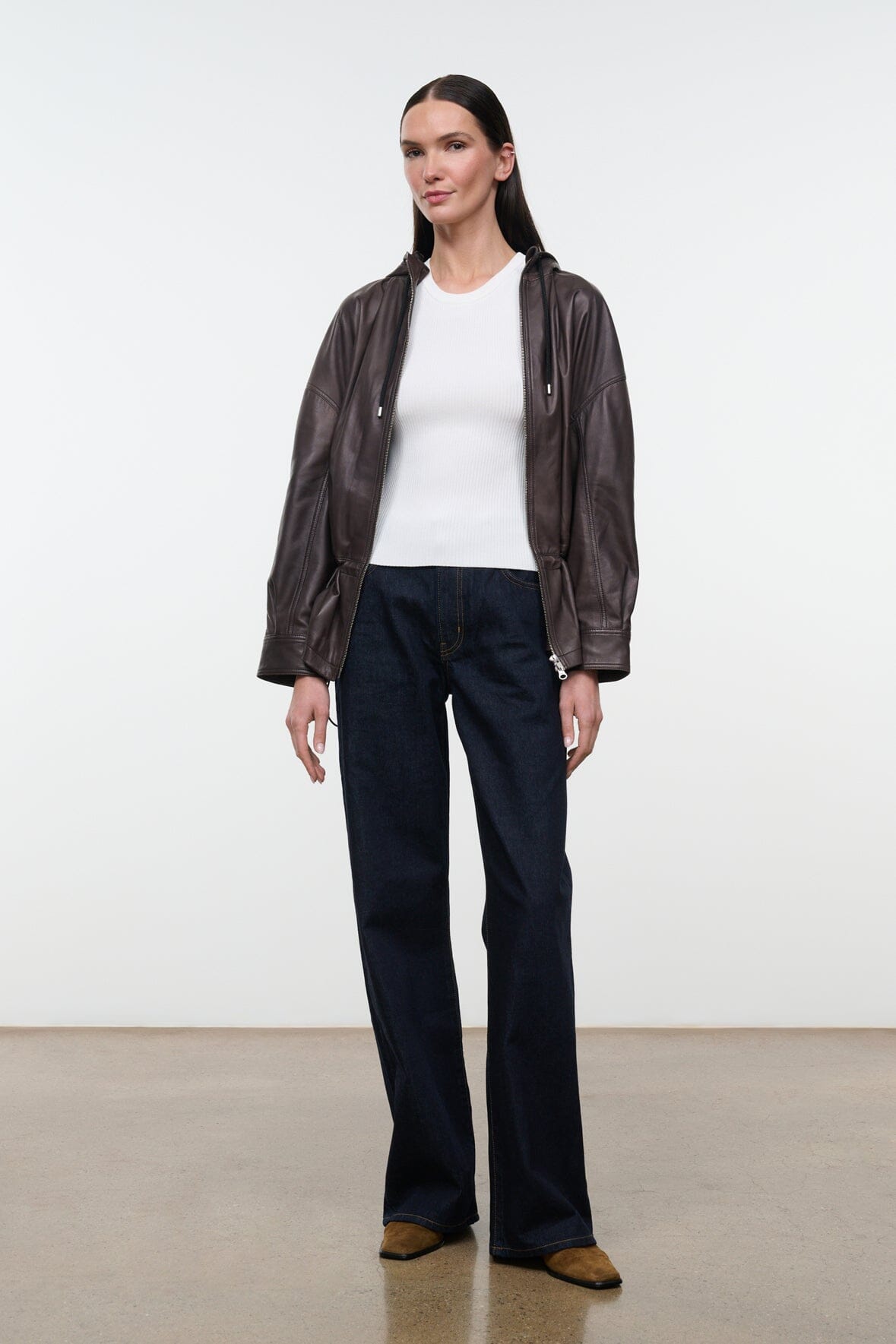 Indigo wide-leg jeans with front slant pockets and dark indigo denim wash.