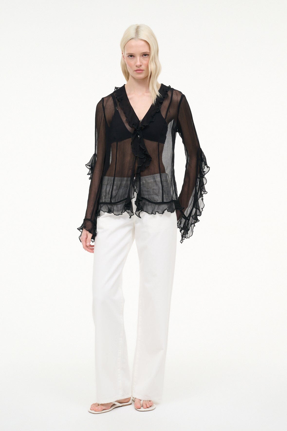 Black sheer ruffle V-neck button top with tiered hem and fluted sleeves
