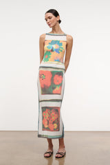 Sleeveless floral knit top on model with straight long hem and striped trim