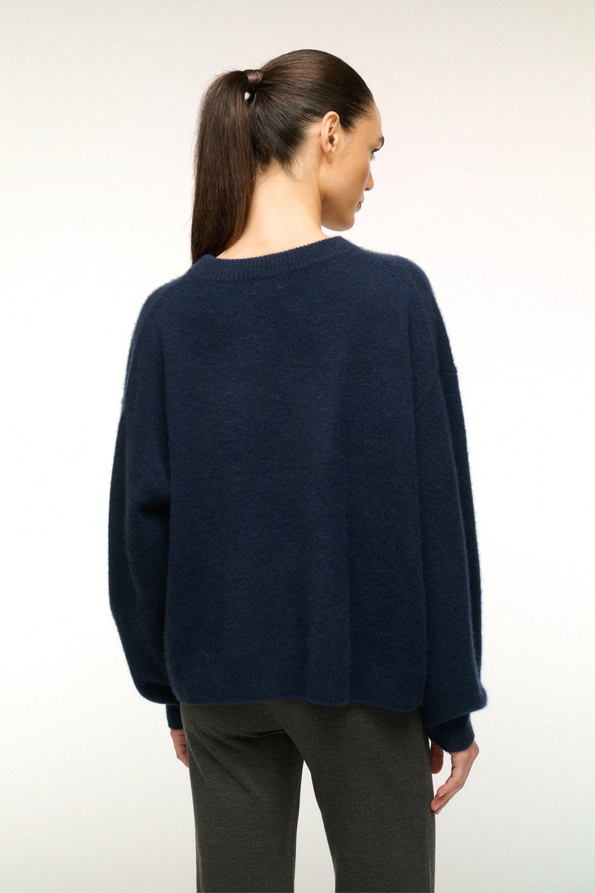 Navy cashmere relaxed crewneck sweater from back view