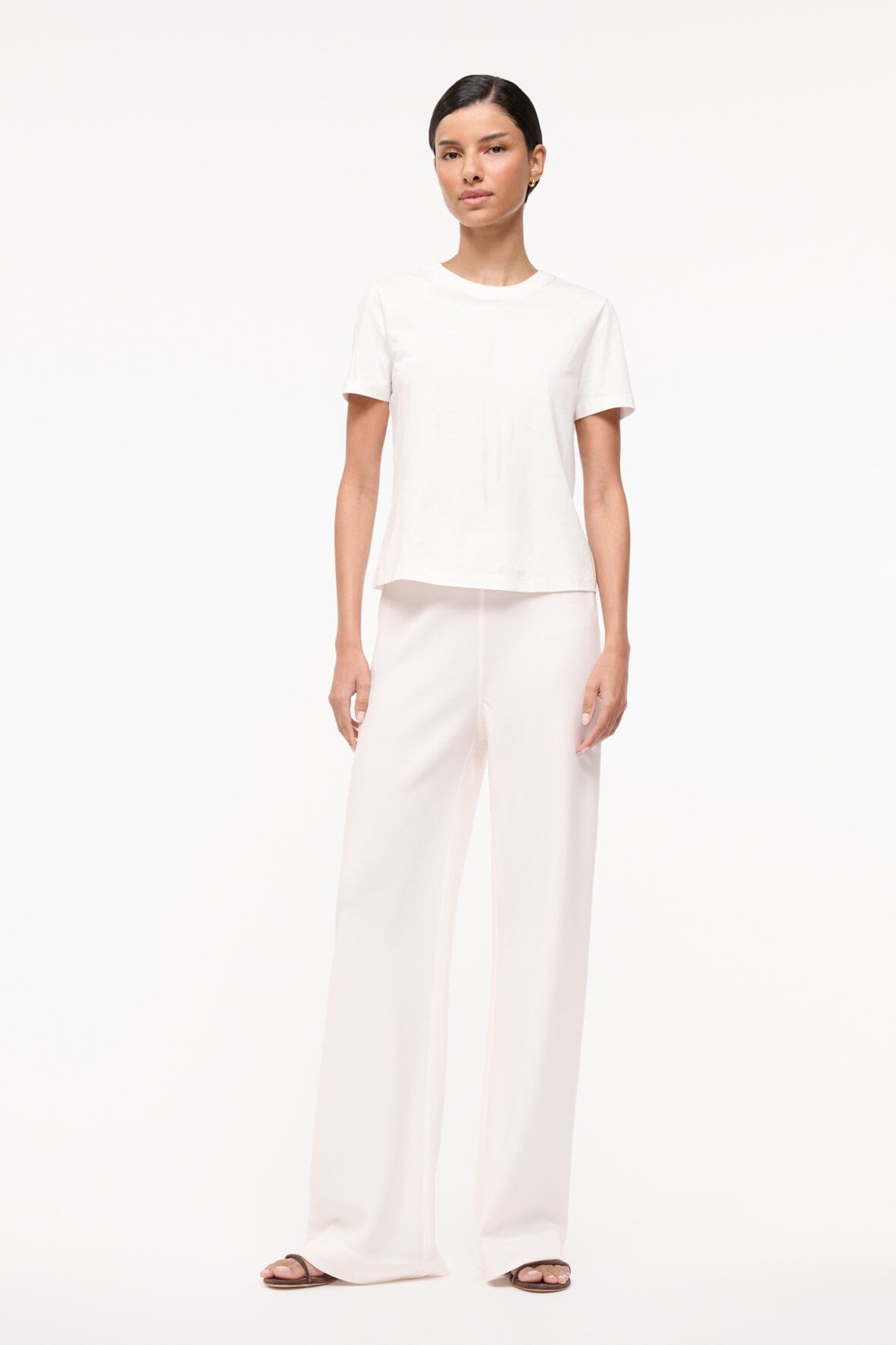 Ivory relaxed-fit wide-leg pants with full-length, fluid movement.