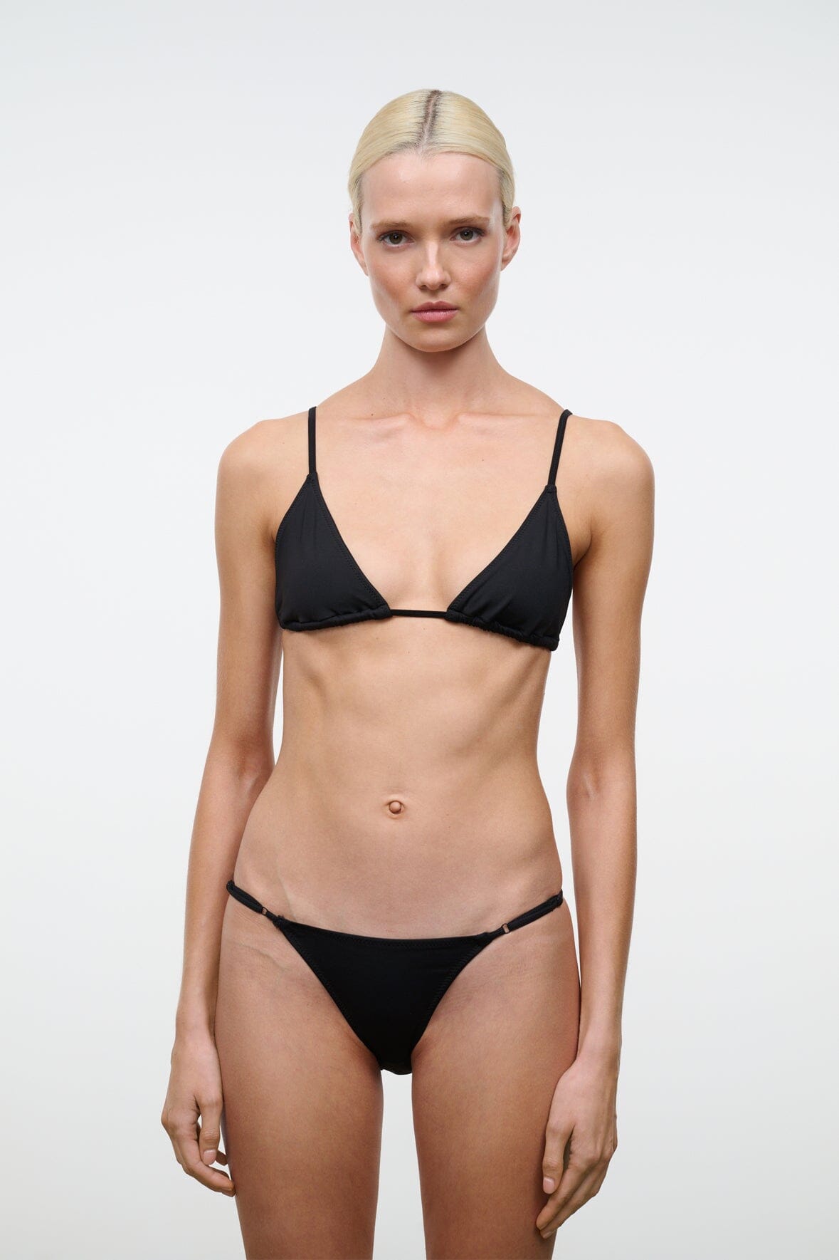Black triangle bikini top worn with matching bikini bottoms