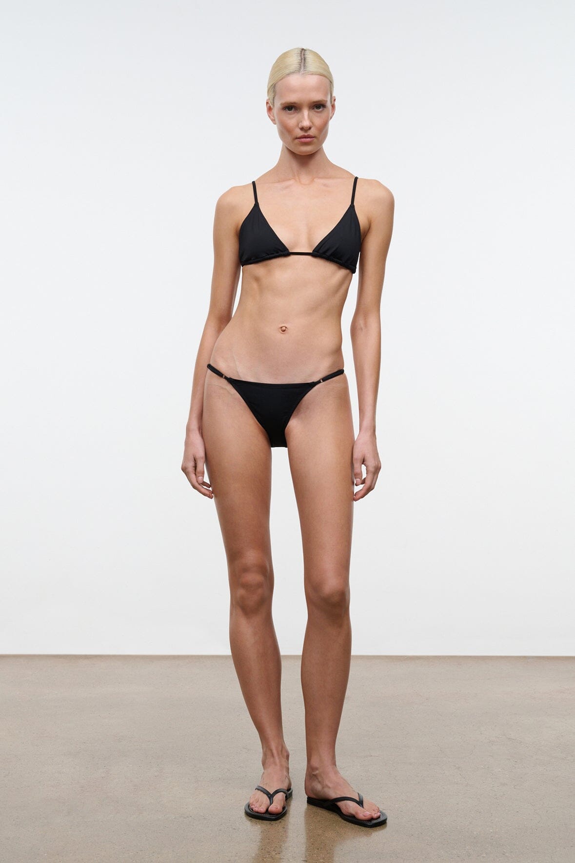 Black triangle bikini top and bikini bottoms on model
