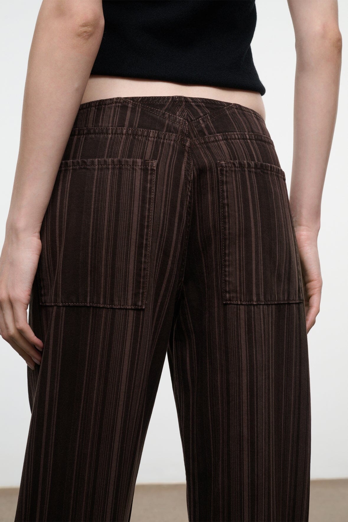 Women’s espresso-brown striped jeans, back view with patch pockets