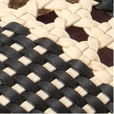 Cream and black crochet ballerina flats with woven lattice pattern
