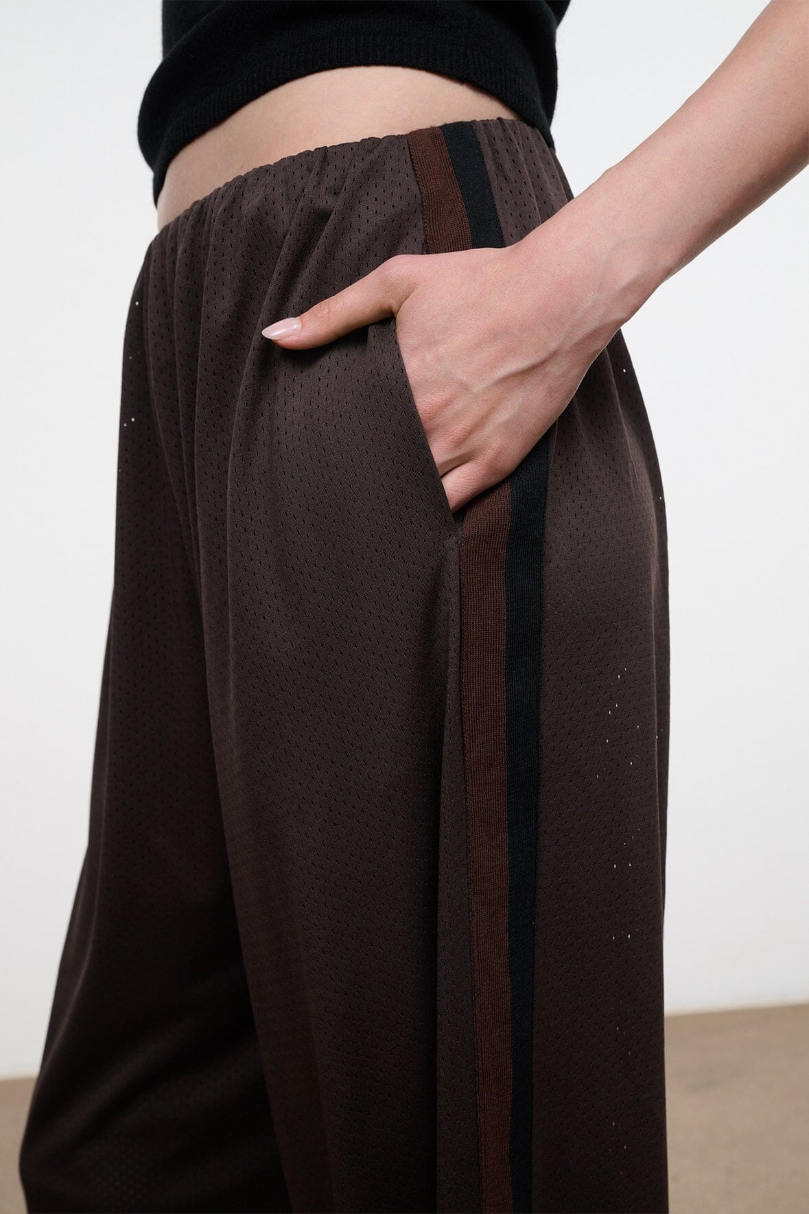 Dark oak wide-leg pants with textured fabric and vertical stripe detail