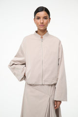 Fawn zip-front jacket with stand collar and gathered hem