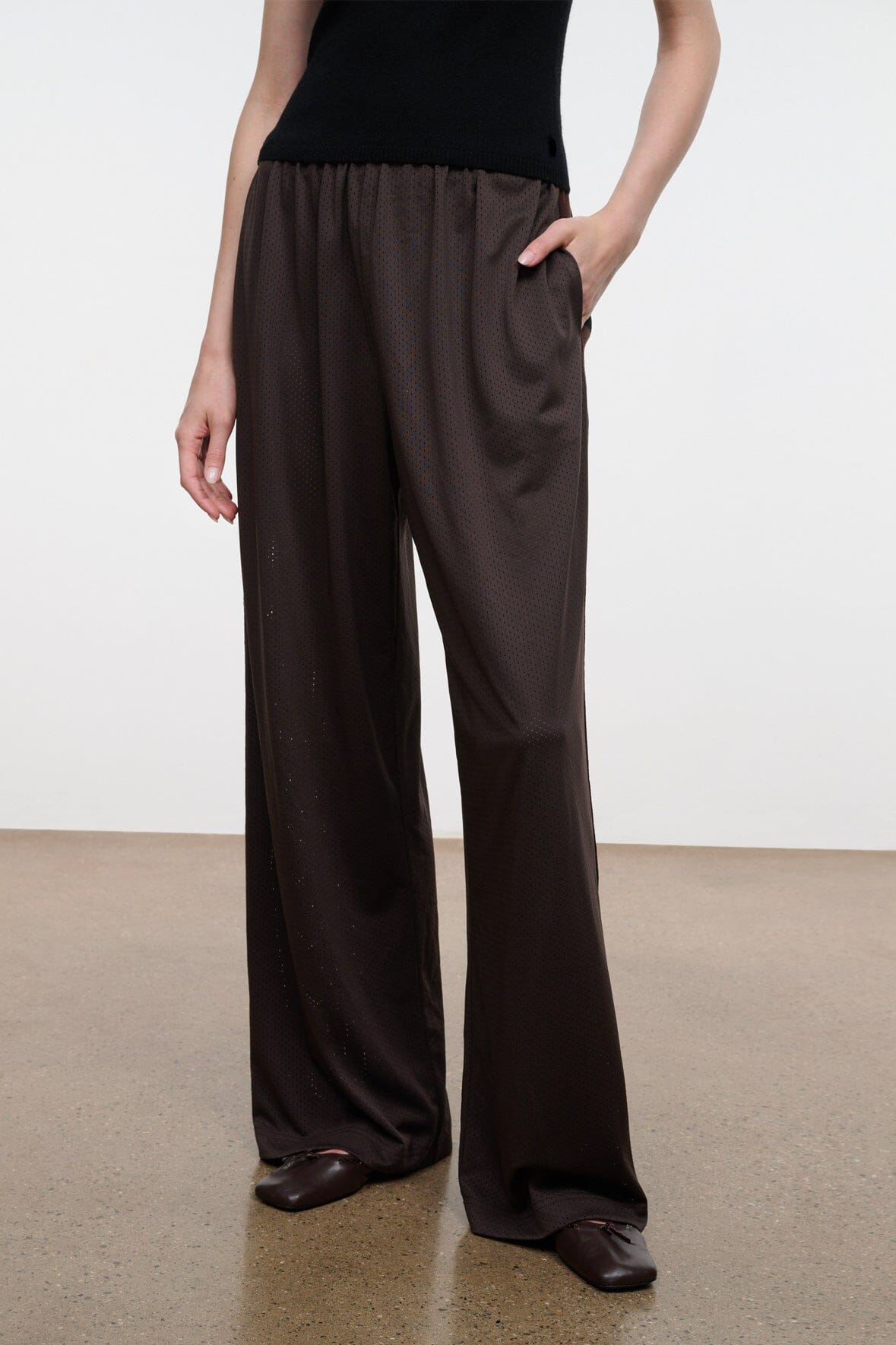 Dark oak wide-leg pants with elastic waistband and flowing full-length drape
