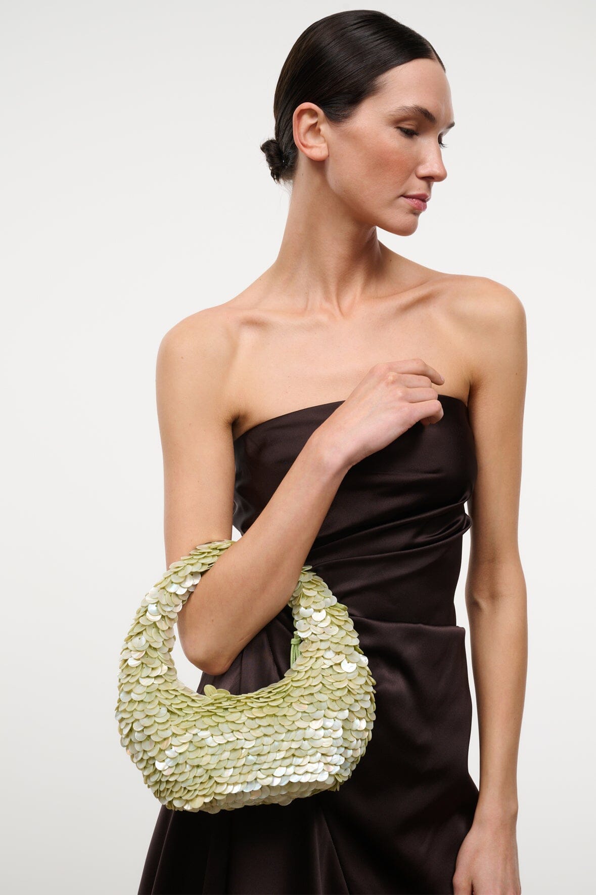Sequin-shell bag in light green with rounded opening and short handle