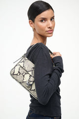 Harlow bag in white snake-print leather with top handle and flap clasp