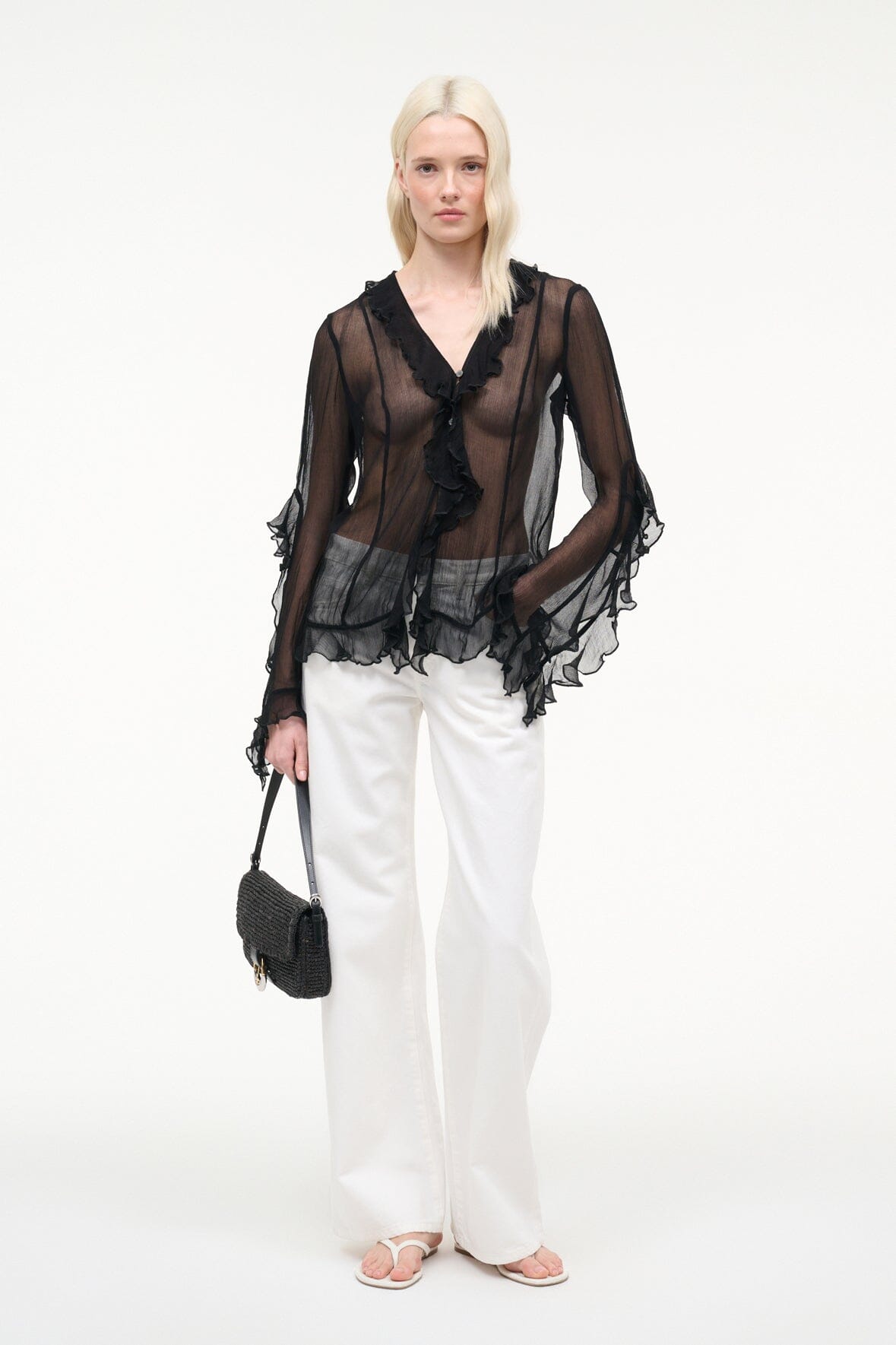 Black sheer ruffle button top with tiered hem and long layered sleeves