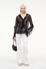 Black sheer ruffle button top with tiered hem and long layered sleeves